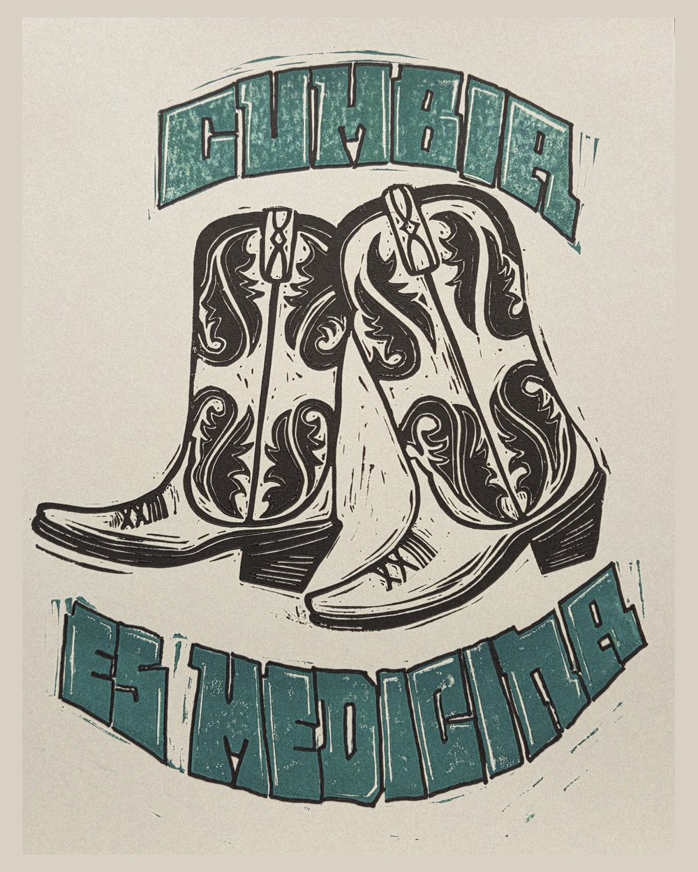 Two-colour linocut: a pair of tooled cowboy boots carved in black, with CUMBIA arched above and ES MEDICINA curving below in teal.