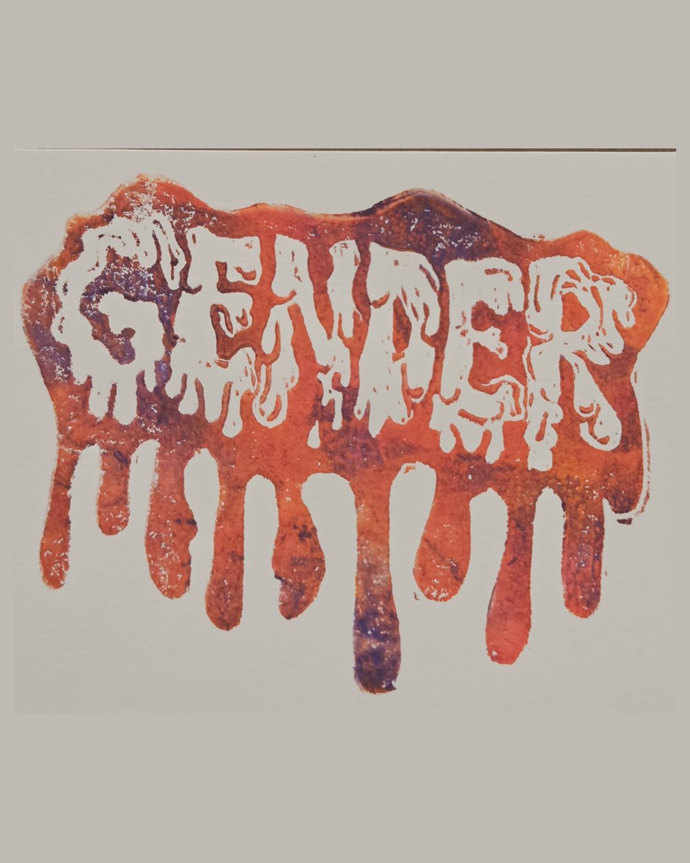 Block print of the word GENDER in white, with orange and purple ink running down the paper in long drips beneath it.
